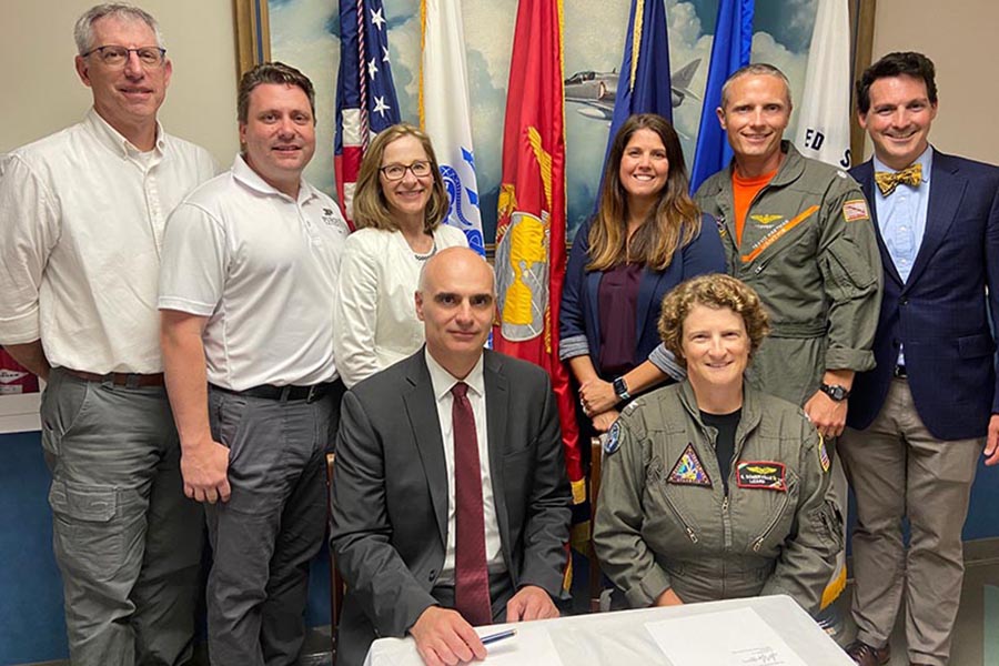 Group photo of Purdue University Online and Navy Academy representatives at the signing of the joint degree agreement.