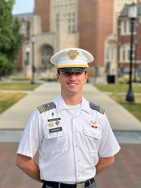 Cadet Charles Rosbrook poses in front of the Purdue Memorial Union wearing his military uniform.