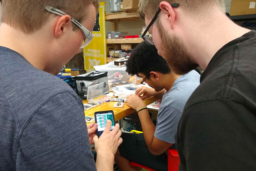 Members of ARC's Wizard's Chess project working together in the Bechtel Innovation Design Center (BIDC)