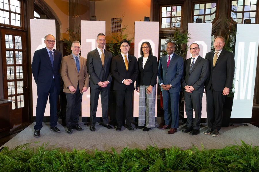 Mark Lundstrom, Jim Bullard, Mike Berghoff, Mung Chiang, Jennett Hill, Johnny Pryor, Ted Maple, and Patrick Wolfe pose for a group photo during the Lilly Endowment announcement on January 9.