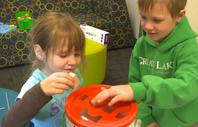 Children playing with engineering-themed toy