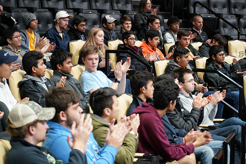 Amanda sitting in Mackey Arena with ENGR 131 students