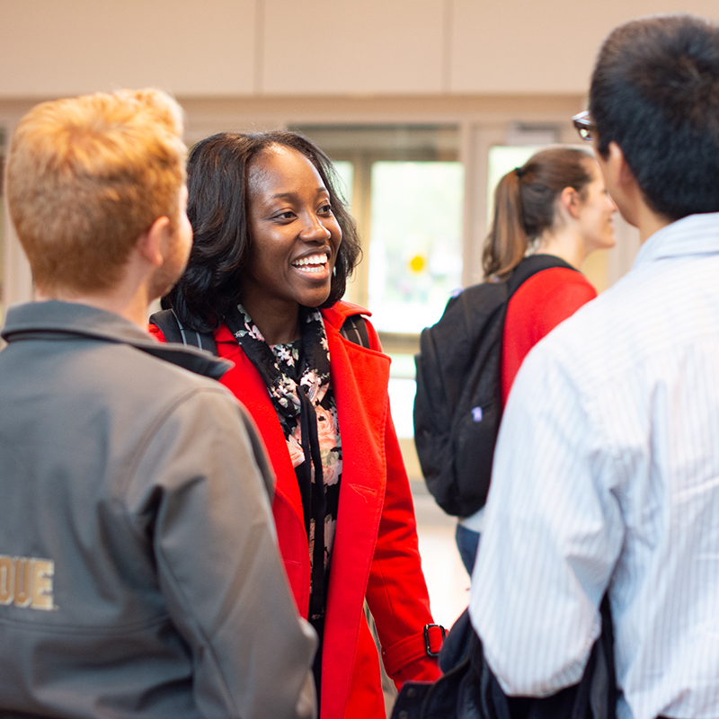 Bunmi visiting with PhD graduate students at IDE Annual Colloquium