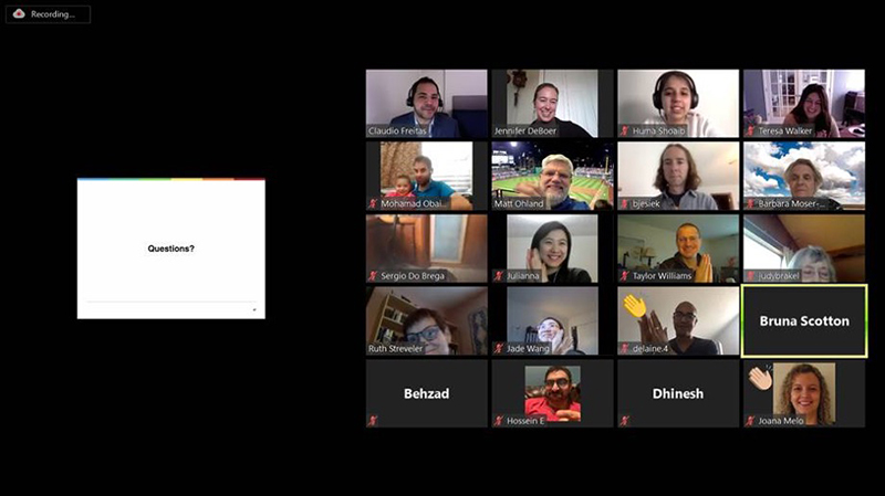 Zoom meeting with many guests on clapping for Claudio's successful presentation