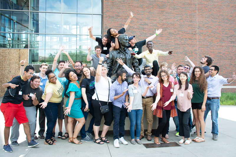 Dina with the new PhD cohort posing with Neil Armstrong
