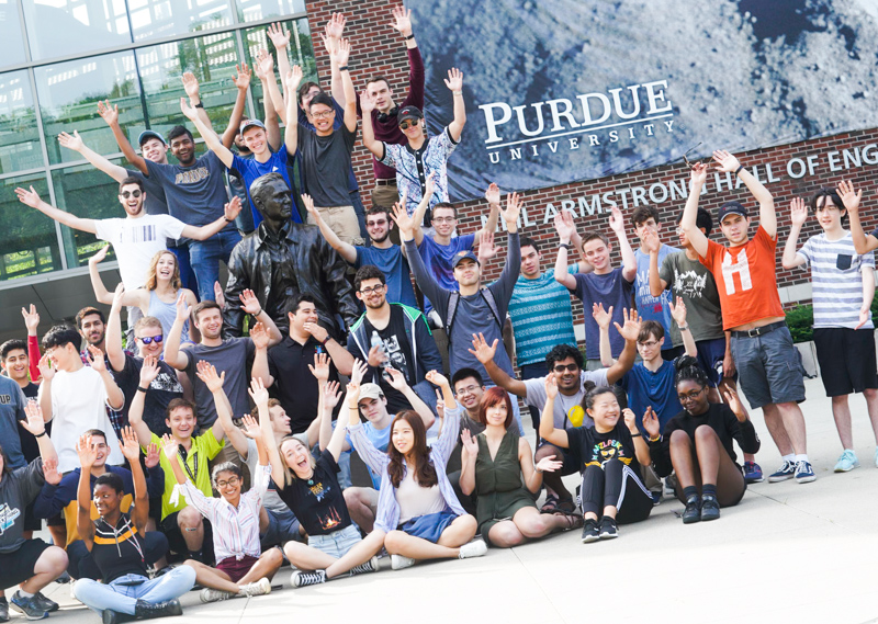 Early Start First-Year Engineering Students pose at Neil Armstrong Statue