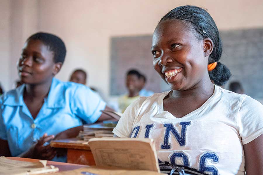 school aged girl sitting at desk