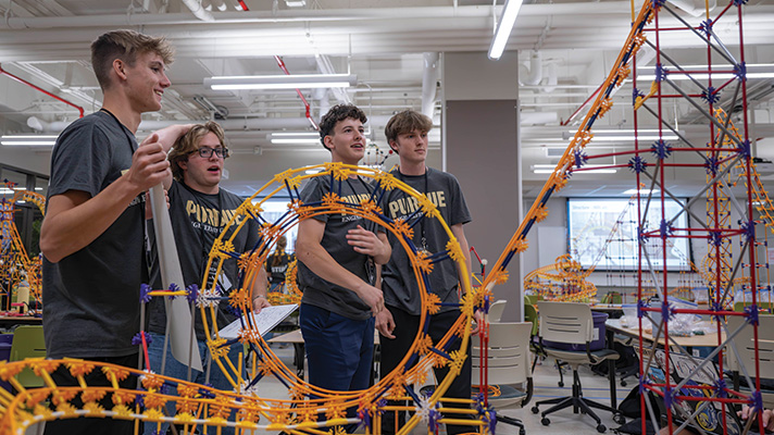 students looking at coaster
